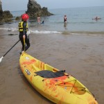 Kayaking at Stackpole on a National Trust family volunteering holiday. Copyright Gretta Schifano