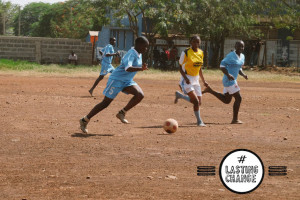 Girls playing football in Kenya. Image by Team Honk