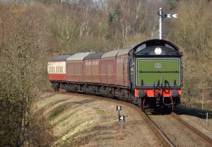 Steam train arriving at Kelling Heath. Copyright Max Rolt Bacino