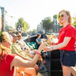 Amsterdam: Guided Open Boat Canal Cruise Including 1 Drink - The Experience in Detail: Pros and Cons