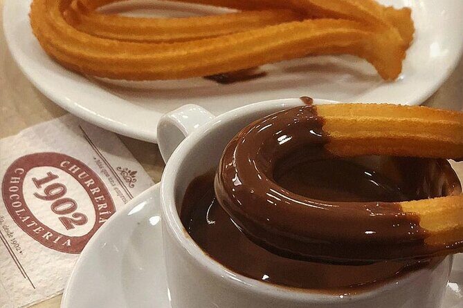 Madrid Bike Tour with Churros and Wine, Ham, and Cheese Upgrade - Discovering Madrid’s Landmarks and Hidden Gems