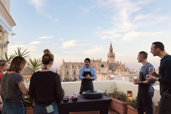 Sevilla: Panoramic Highlights Rooftop Tour & Paella Cooking Class - The Setting and Atmosphere