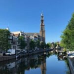 Amsterdam: Hidden Gems and Highlights in DE/EN/IT - Exploring the Hidden Courtyards and Charming Streets