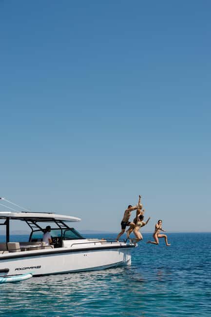 Athens: Private Boat Trip to Poros & Hydra with Swimming - First Stop: Poros Island and Its Charming Beaches