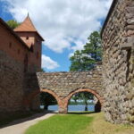 From Vilnius: Trakai Castle and Paneriai Memorial Tour - Free Time and Food
