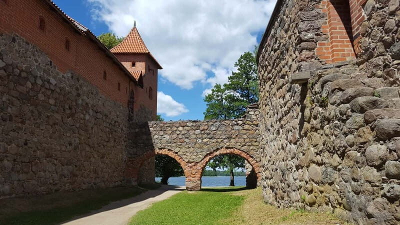 From Vilnius: Trakai Castle and Paneriai Memorial Tour - Free Time and Food
