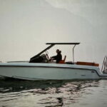 Lake Como Boat tour share- prosecco and winter cover - The Itinerary: What to Expect