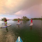 Lyon: Sunset Apéro on a lighted paddleboard at Miribel Jonage Park - The Experience Itself