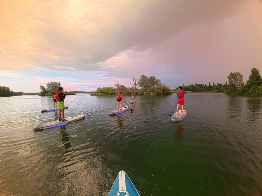 Lyon: Sunset Apéro on a lighted paddleboard at Miribel Jonage Park - The Experience Itself