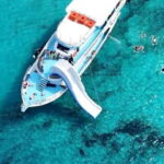 Paphos Blue Lagoon Cruise: Slide, Music & Hotel Transfer - Embarking at Latchi Harbour