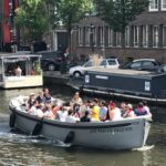 Visit Amsterdam by Boat with a French Guide (french) - The Experience in Detail