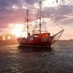 Feel the love on a romantic dinner at Cancun sea, with live music and open bar. - The Itinerary Breakdown