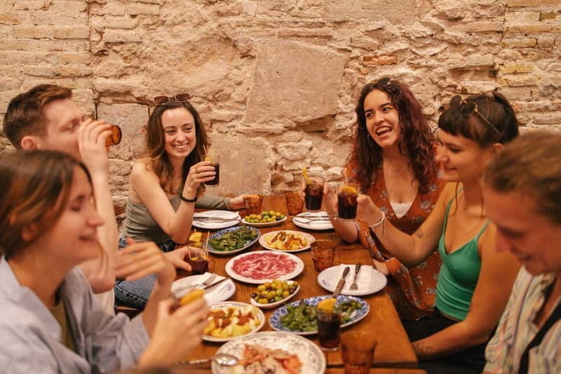 Barcelona: Food Walking Tour with Tapas and Wine - Price and value: $100 for 150 minutes of organized tapas and drinks
