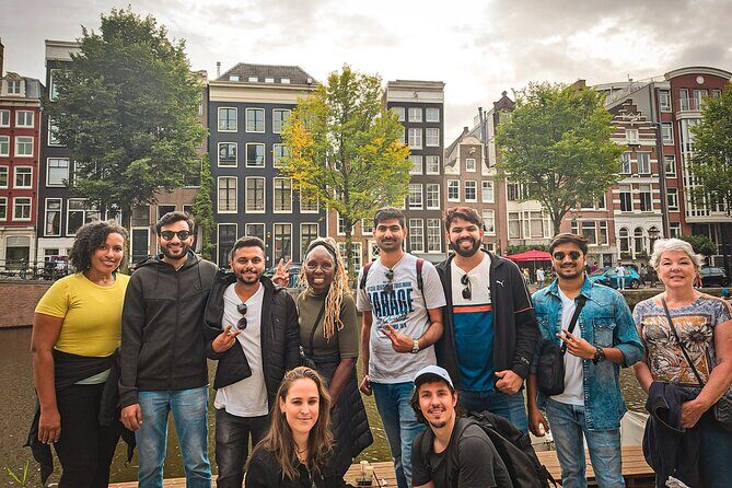 Small Group Walking Tour - Hello Amsterdam - Damrak Play-Game Stop: Learning Amsterdam Without Feeling Like a Lesson