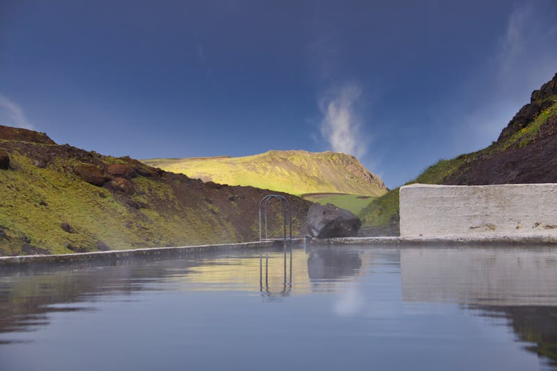 Hot spring pool in Icelandic mountains