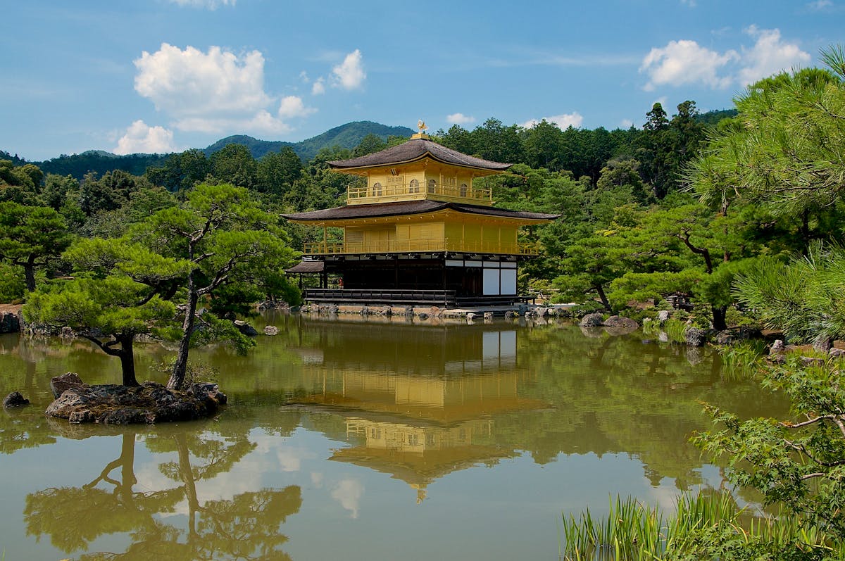 Kinkaku-ji Golden Pavilion reflected in pond in Kyoto