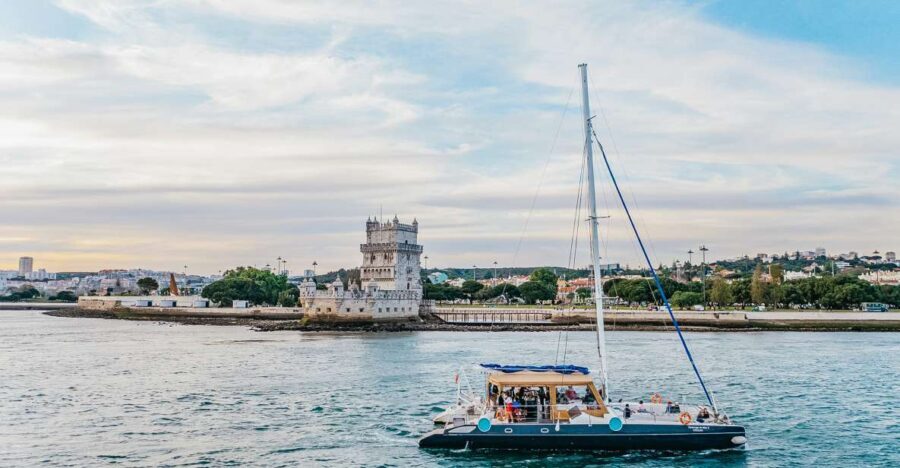 Lisbon: Sunset Catamaran Boat Tour with Music and Drinks - Where You Meet: Doca de Santo Amaro, Door 3