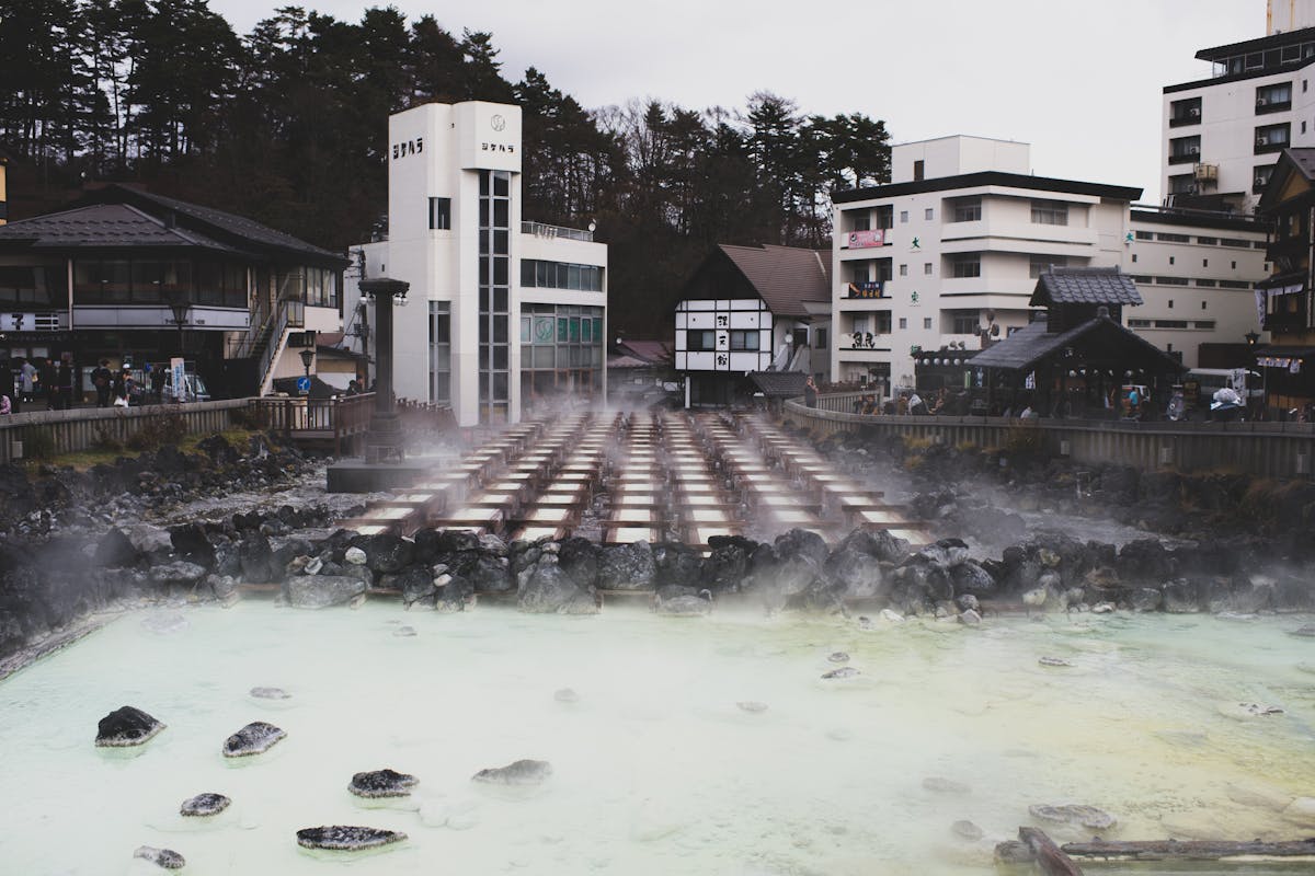 Hot spring town with steam rising from mineral waters