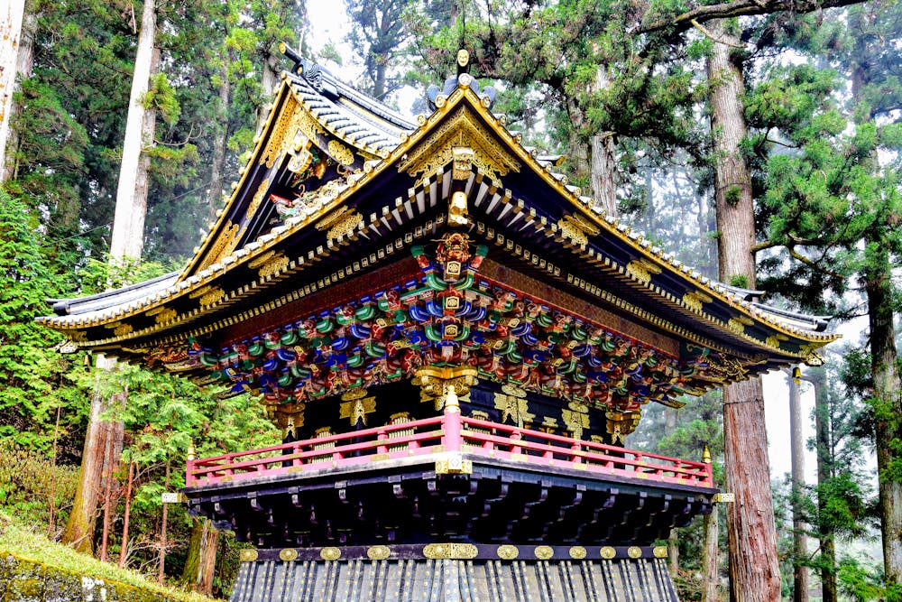 Ornate Japanese temple amongst trees in Nikko Japan