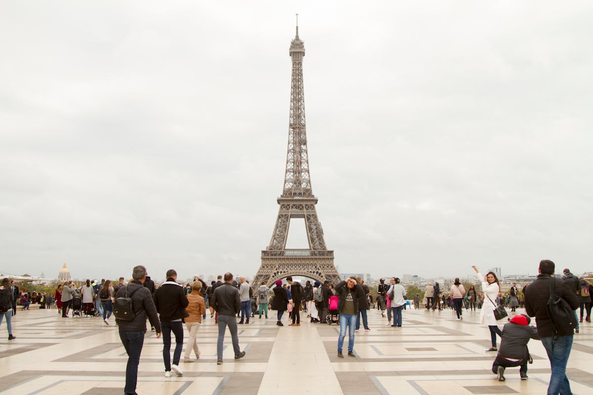 Eiffel Tower in Paris with travelers