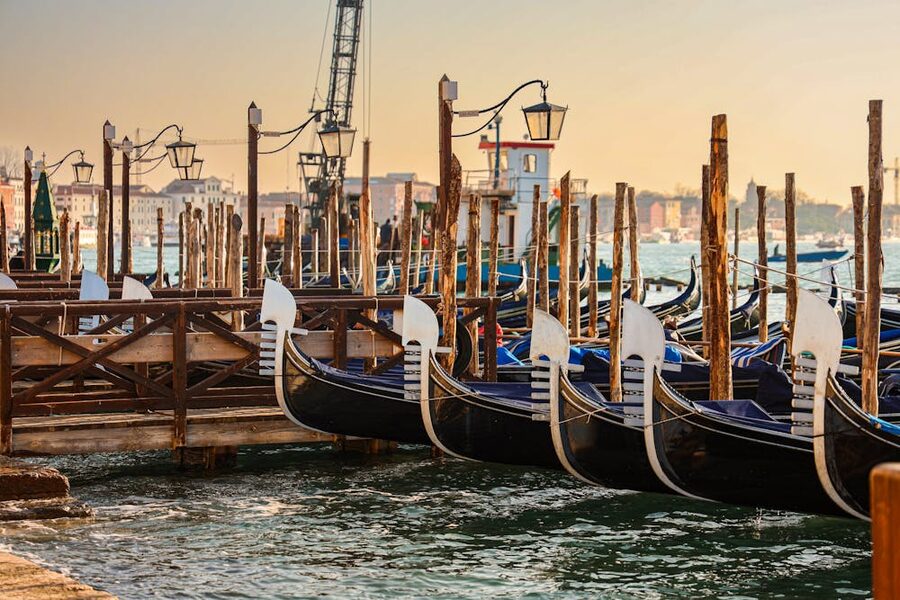 Gondolas moored at sunrise in Venice