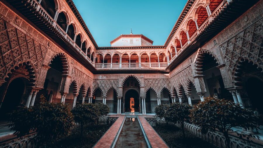 Courtyard with trees and water at Alcazar Seville