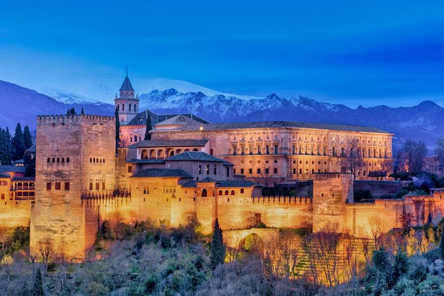 Alhambra illuminated with snowy mountains