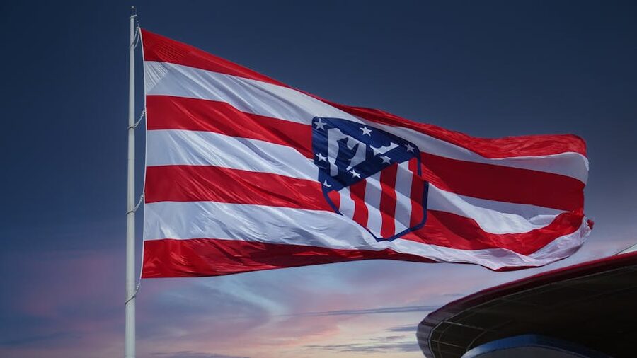 Atletico Madrid flag waving against sunset sky