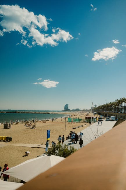 Barcelona beach boardwalk with people walking