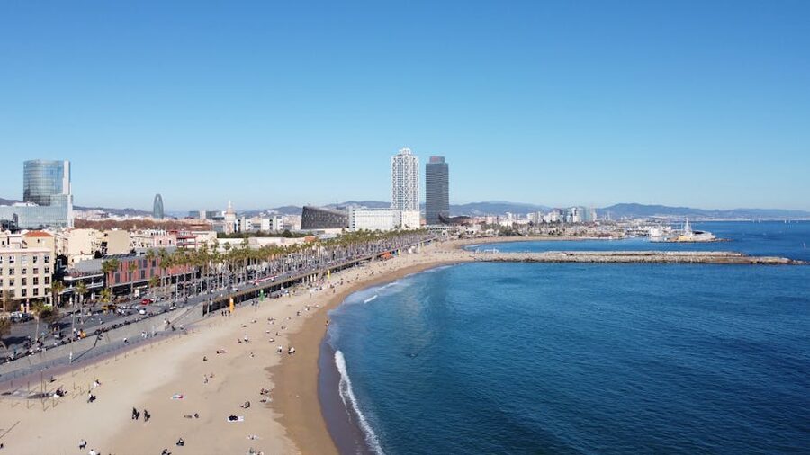 Barcelona beach with city skyline visible from the sea