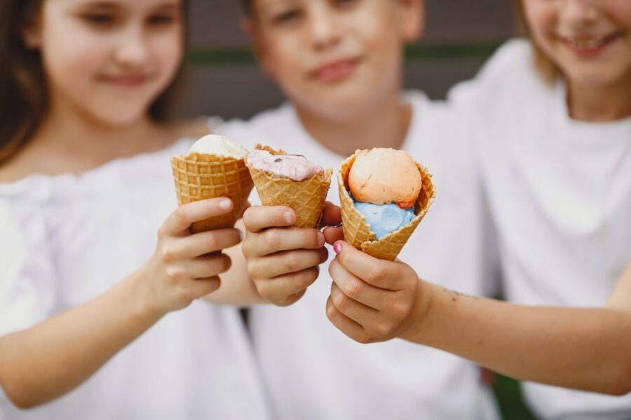 Children enjoying ice cream on a sunny summer day