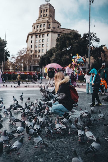 Children playing in a sunny plaza in Barcelona