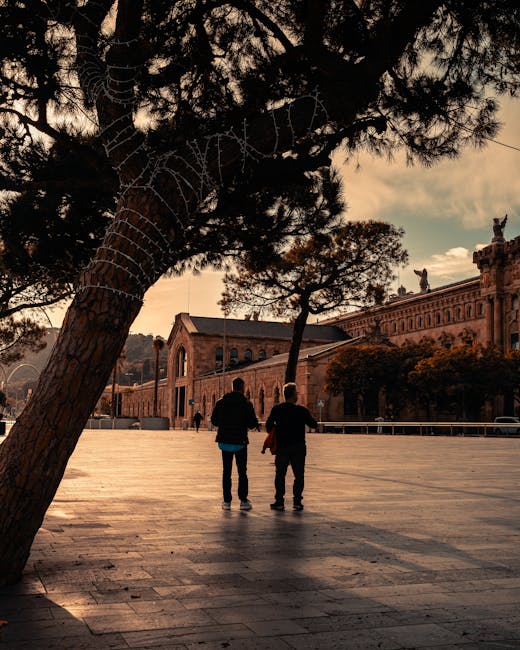 Family walking through Barcelona streets at sunset