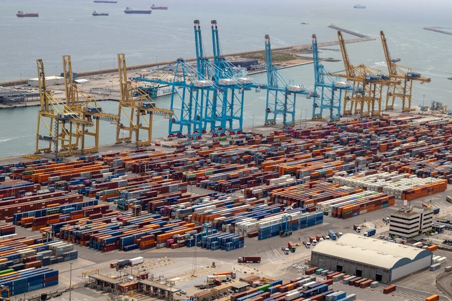 Tour boat in Barcelona harbour with city skyline behind