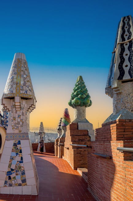 Colourful mosaic chimney on a Gaudi rooftop in Barcelona