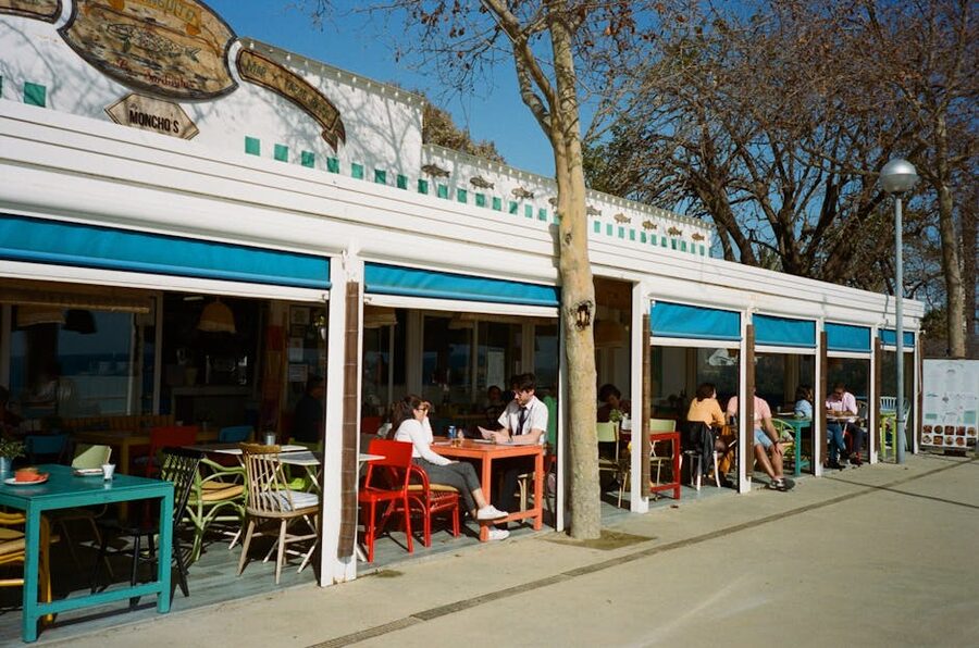 Outdoor cafe terrace on a Barcelona street with diners