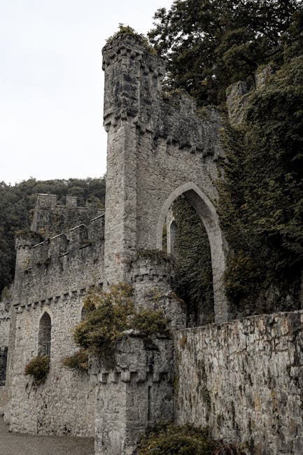 Stone walls and towers of a medieval castle fortification