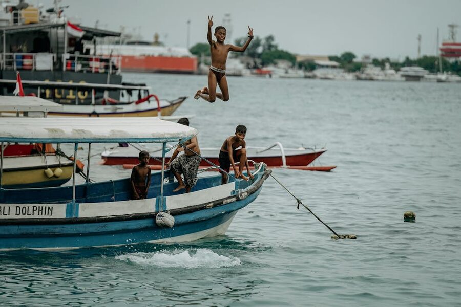 Excited children on a boat trip at sea