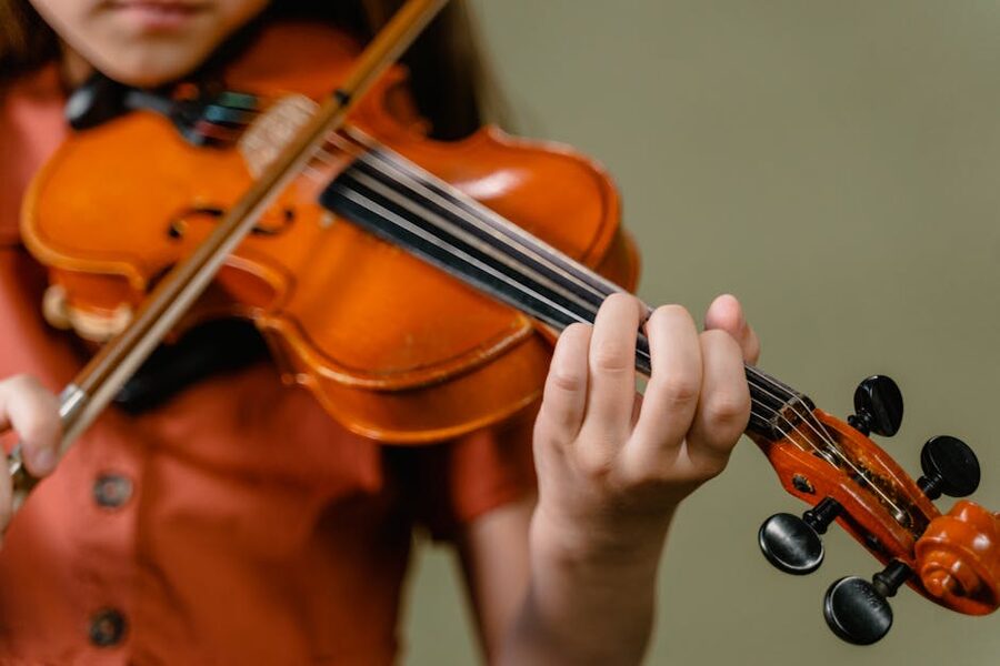 Children learning to play classical violin
