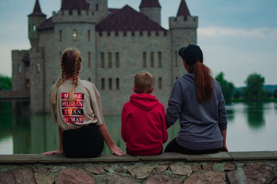 Children climbing and exploring old castle walls