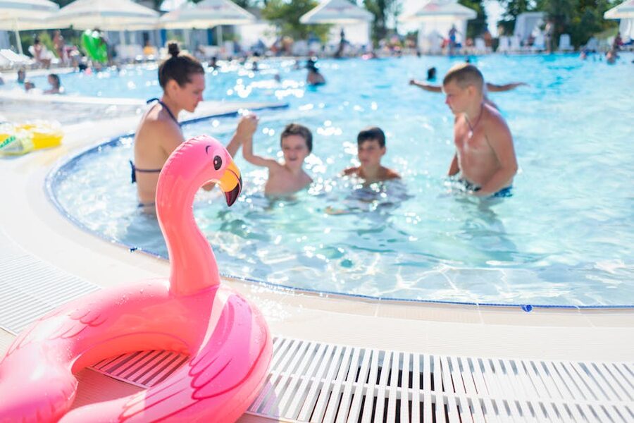 Children enjoying an outdoor swimming pool