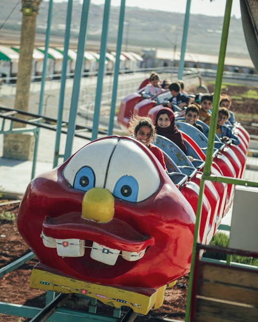 Children with excited expressions on a theme park ride