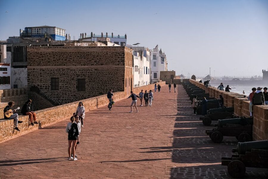 Children walking along the top of a medieval city wall