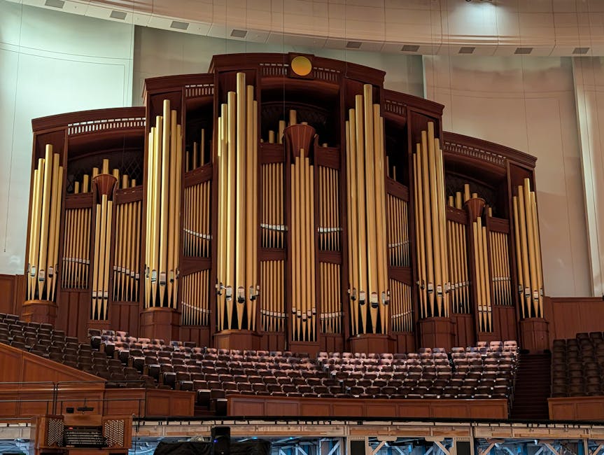 Grand organ pipes and stage inside a concert hall