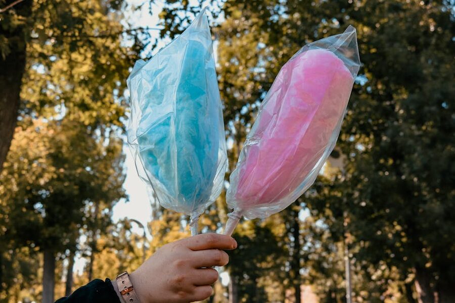 Pink cotton candy sweet treat held up