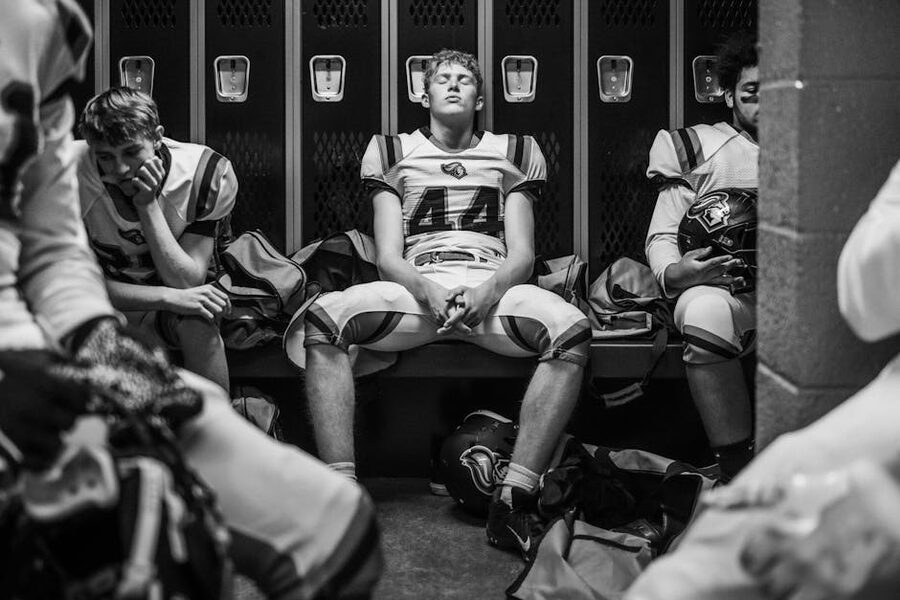 Football team dressing room with lockers and benches