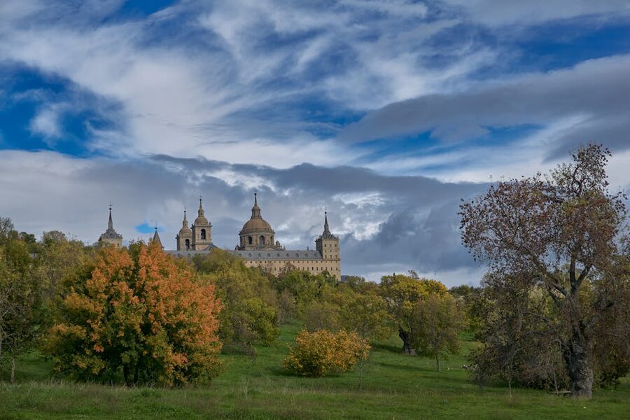 El Escorial Monastery in autumn under blue sky