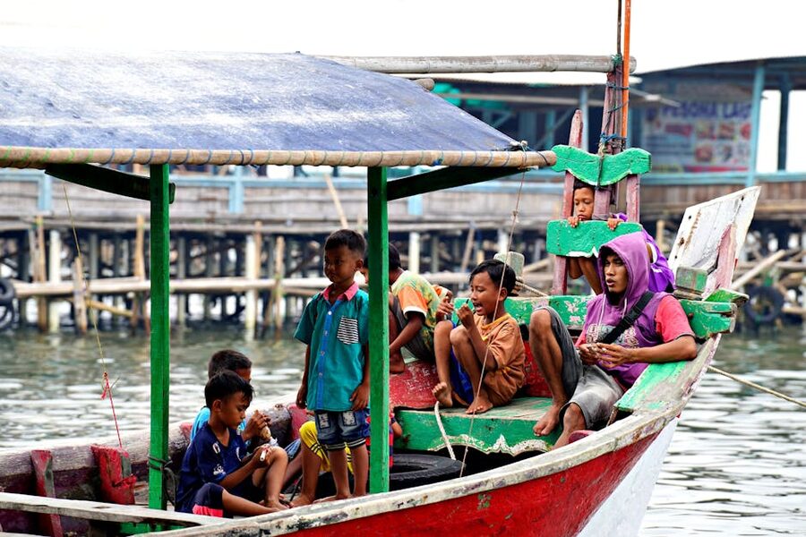 Family enjoying a boat trip with children on the sea