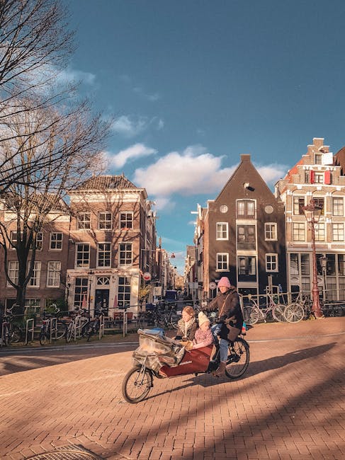 Family riding bicycles through a European city street