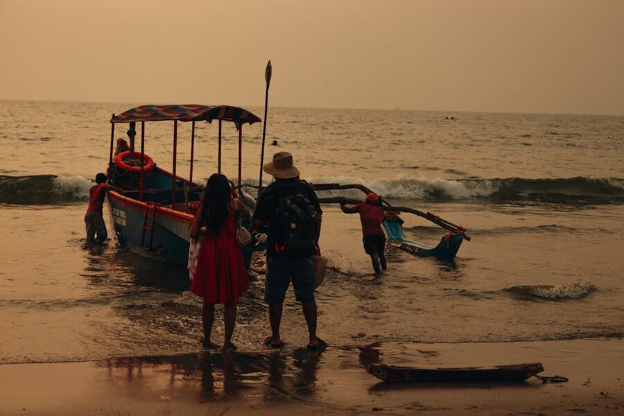 Family on boat holiday at sea during sunset